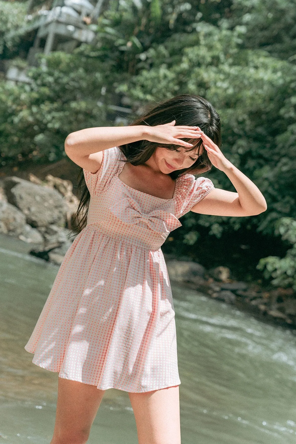 LOUISA BABYDOLL GINGHAM ROMPER DRESS IN PEACH PINK